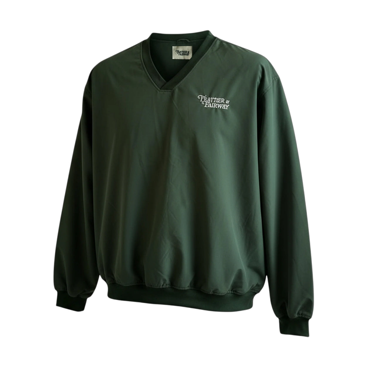 Green windbreaker with 'Feather & Fairway' logo on a white background